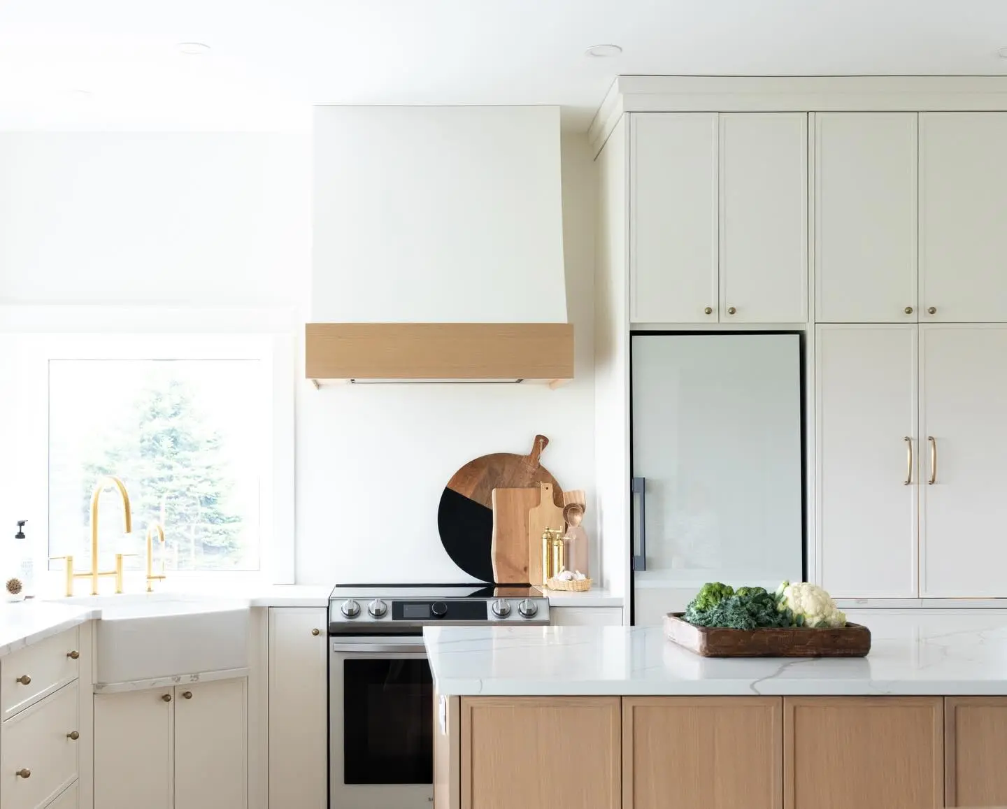 Oak kitchen with island and hardware cabinetry by Heirlooms Custom Cabinetry