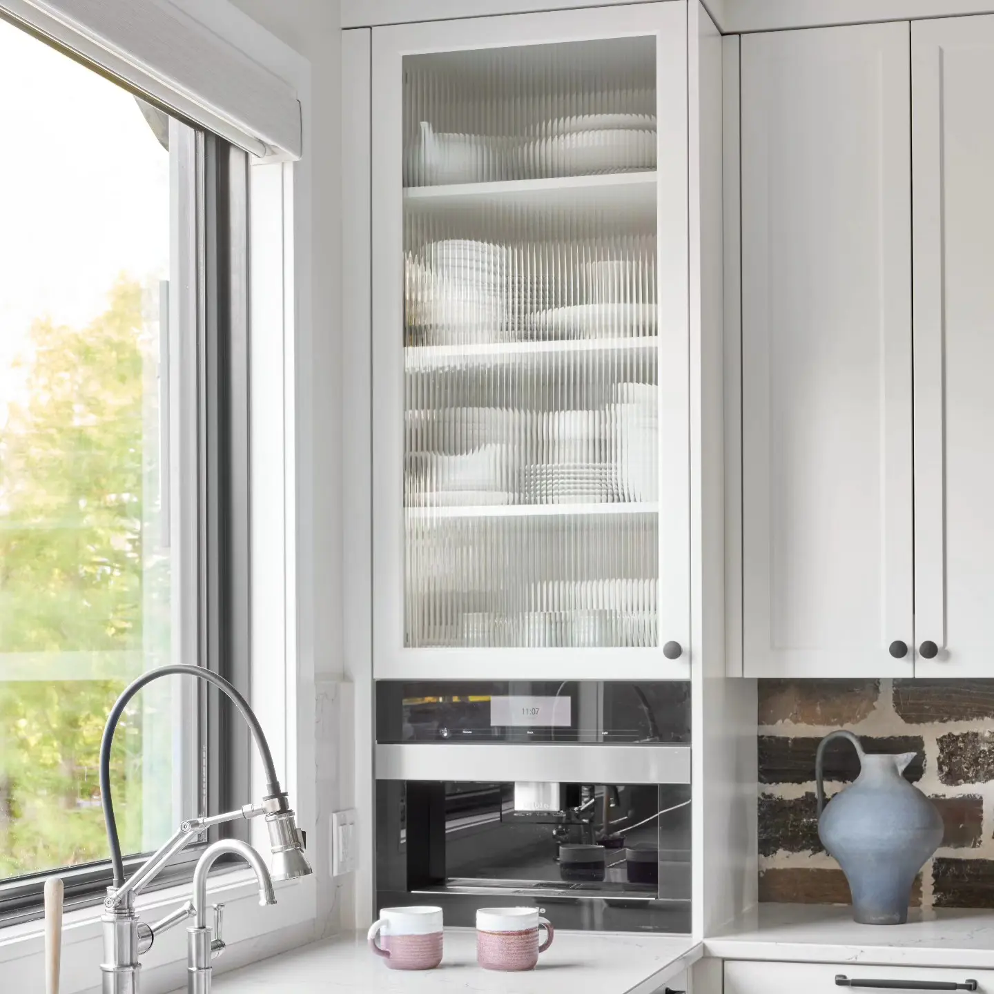 Reeded glass kitchen cabinetry by Heirlooms Custom Cabinetry