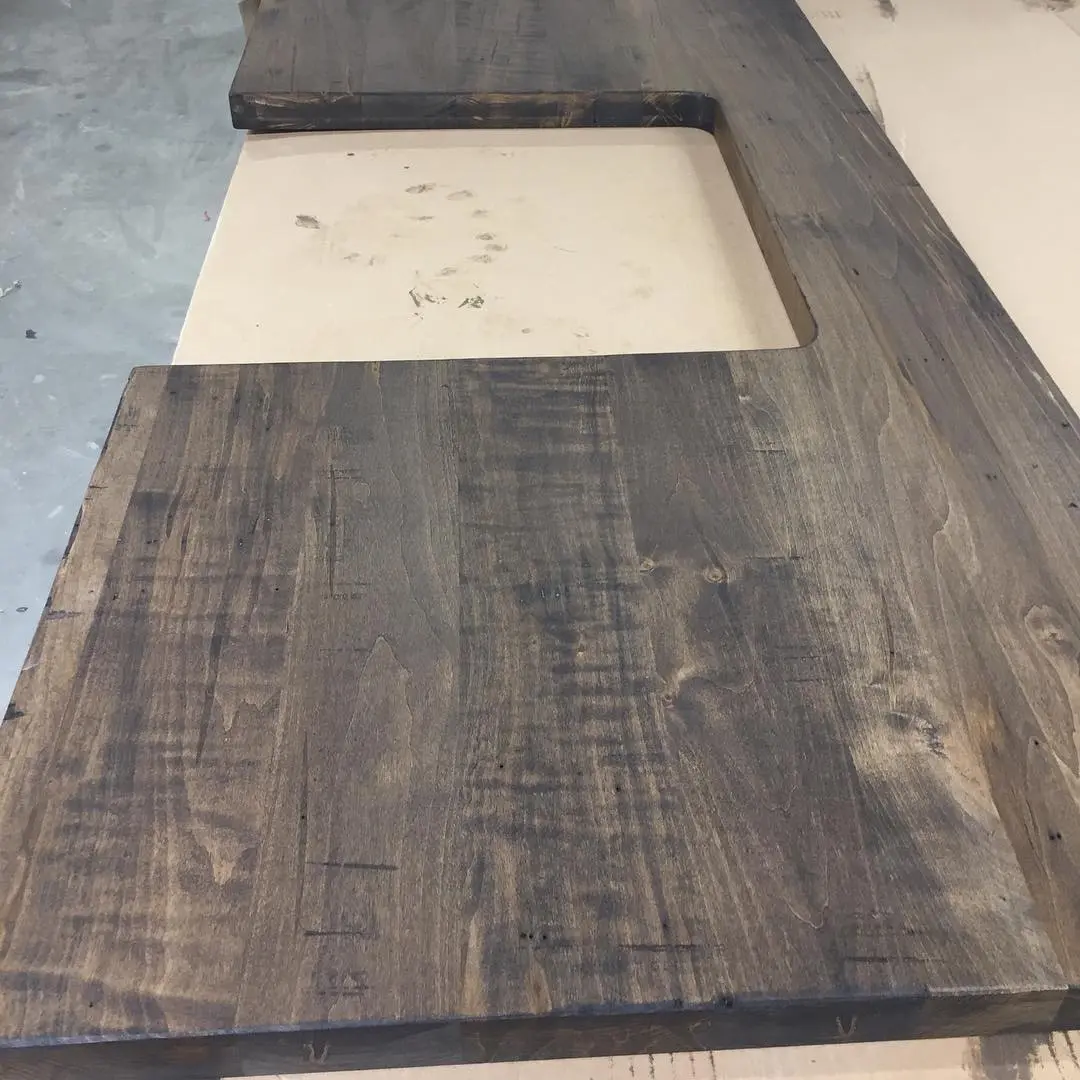 Stained maple vanity with vanity cabinetry by Heirlooms Custom Cabinetry