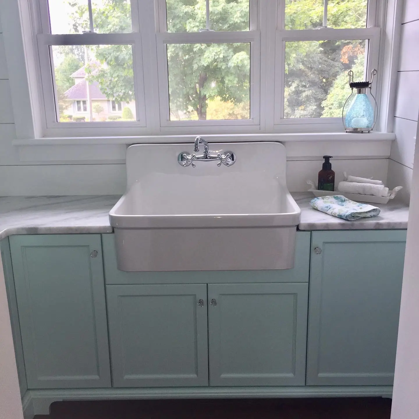 Quartz laundry cabinetry by Heirlooms Custom Cabinetry