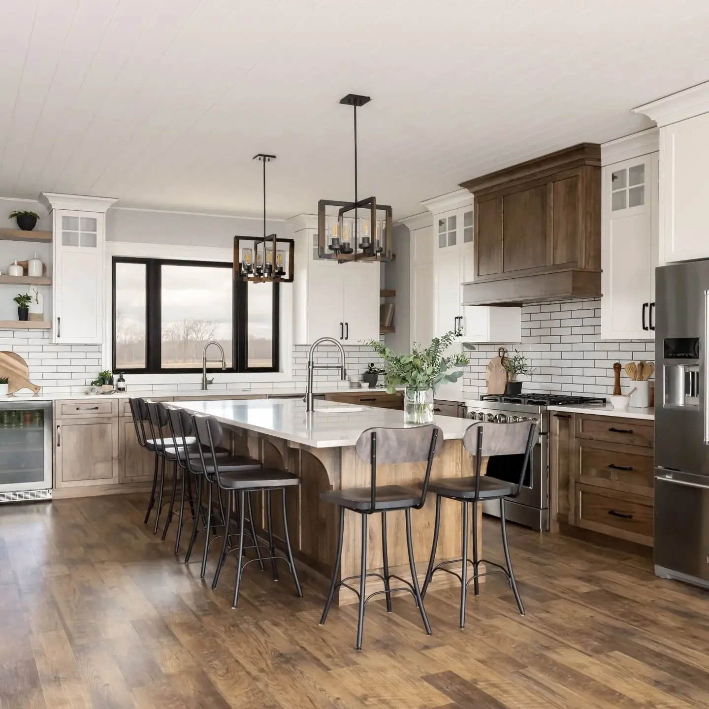 Stained maple kitchen with countertop and hardware cabinetry by Heirlooms Custom Cabinetry