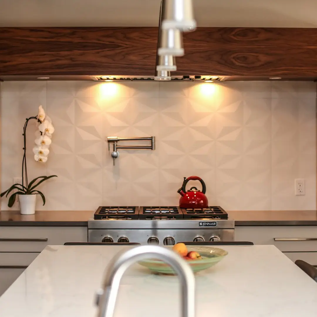 Grain matched walnut kitchen with storage cabinetry by Heirlooms Custom Cabinetry