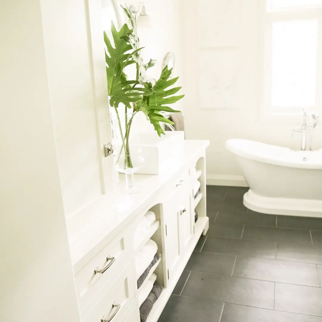 Vanity with open shelving and shelf cabinetry by Heirlooms Custom Cabinetry