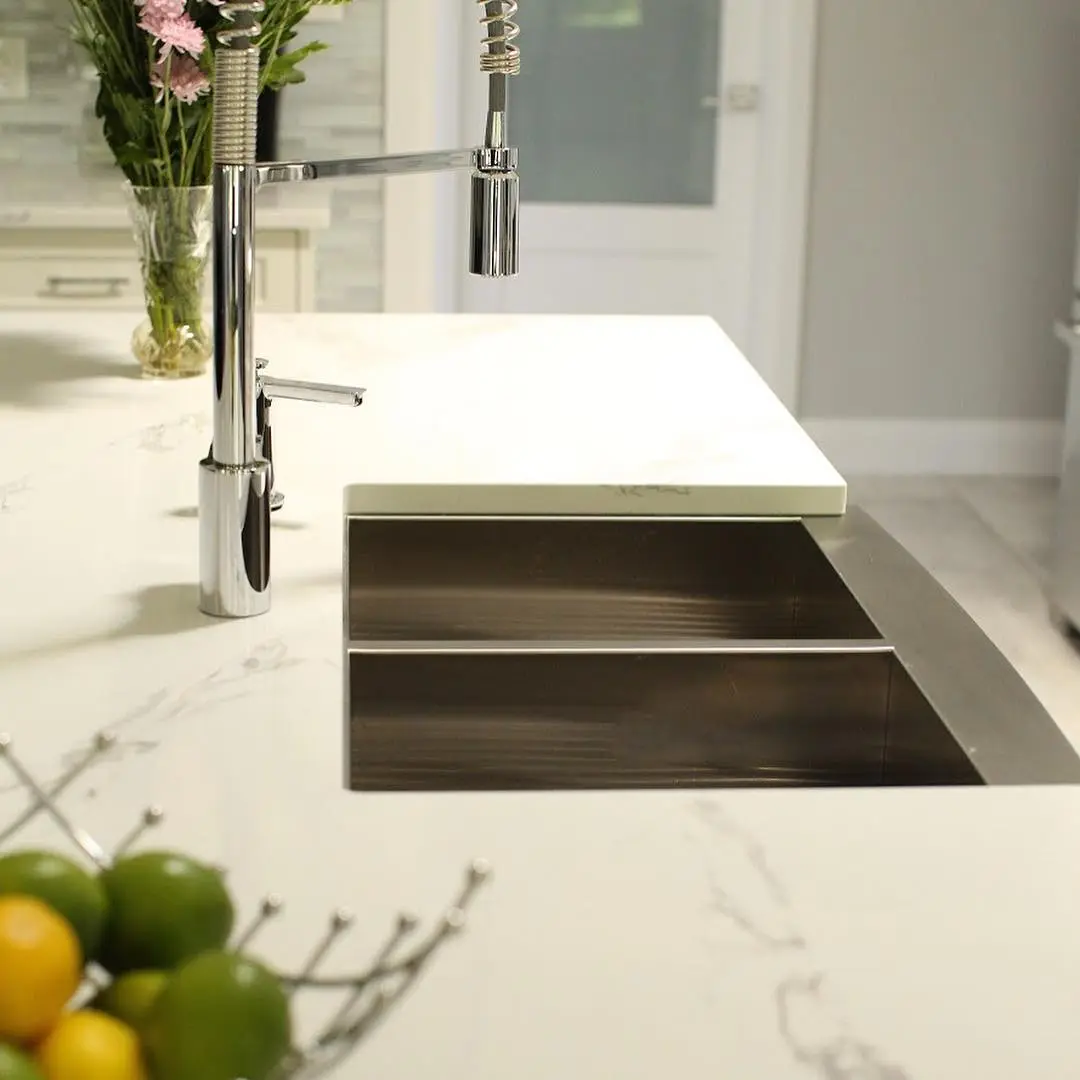 Kitchen with range hood and beverage bar cabinetry by Heirlooms Custom Cabinetry